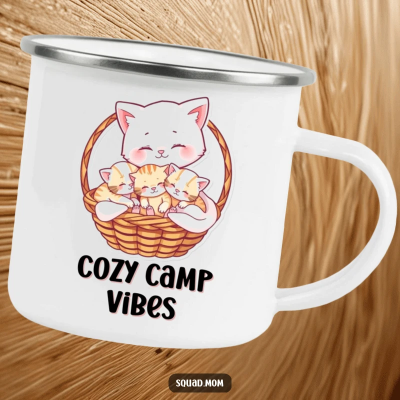 Funny camping mug showing a mama cat cuddling her playful kittens in a basket, perfect for cozy outdoor moments.