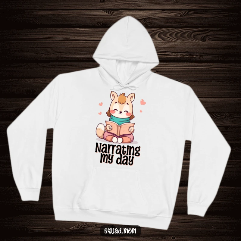 Funny Kawaii Mom Friend Hoodie: A cute animal character reads a storybook, offering a warm and inviting vibe for story lovers.