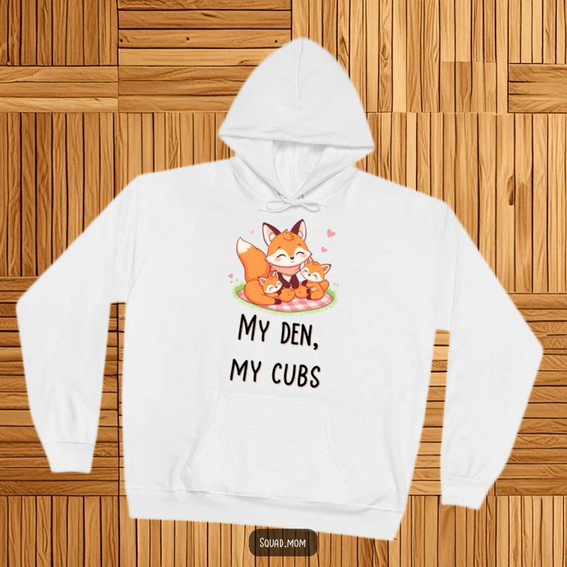 Funny Fox Mom and her kits sharing a picnic blanket in a cozy hoodie design, emphasizing family bonding and warmth.