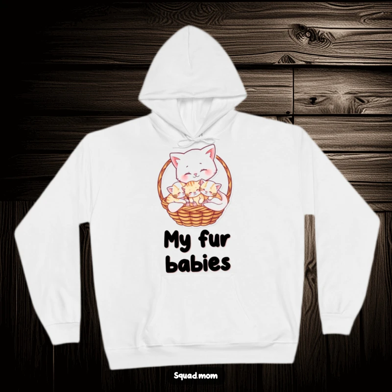 Funny hoodie with a soft, warm design of a mama cat cuddling her playful kittens in a cozy basket, perfect for comfort.