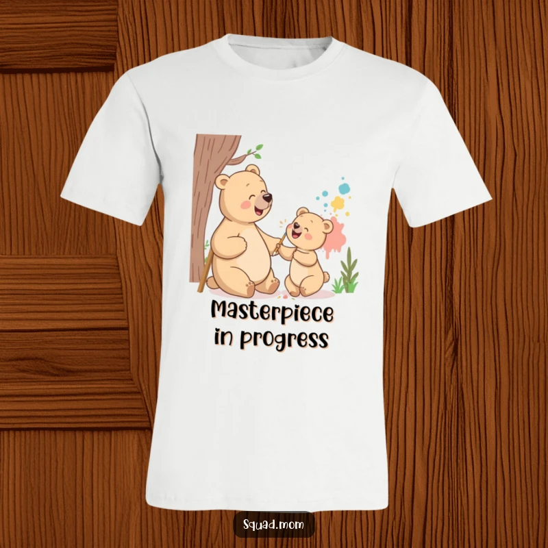 Funny bear mom and cub t-shirt depicting them giggling while painting a mural, ideal for celebrating artistic moms and family fun.