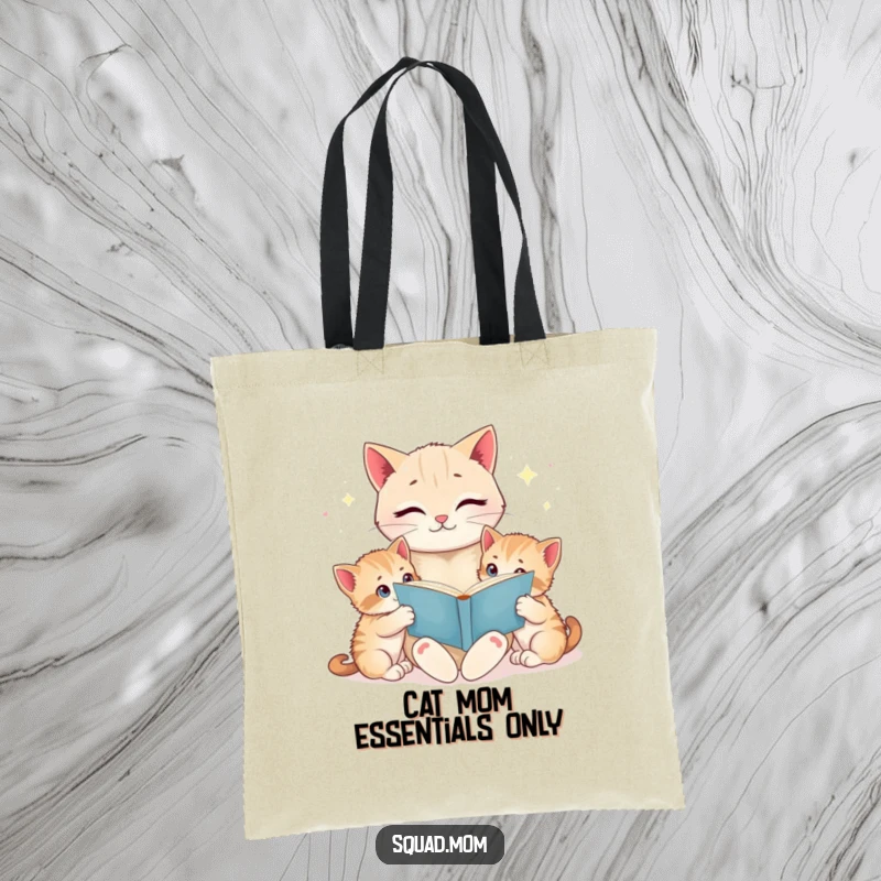 Funny cat mom reading a bedtime story to her wide-eyed kittens, printed on a durable tote bag, great for shopping and errands.