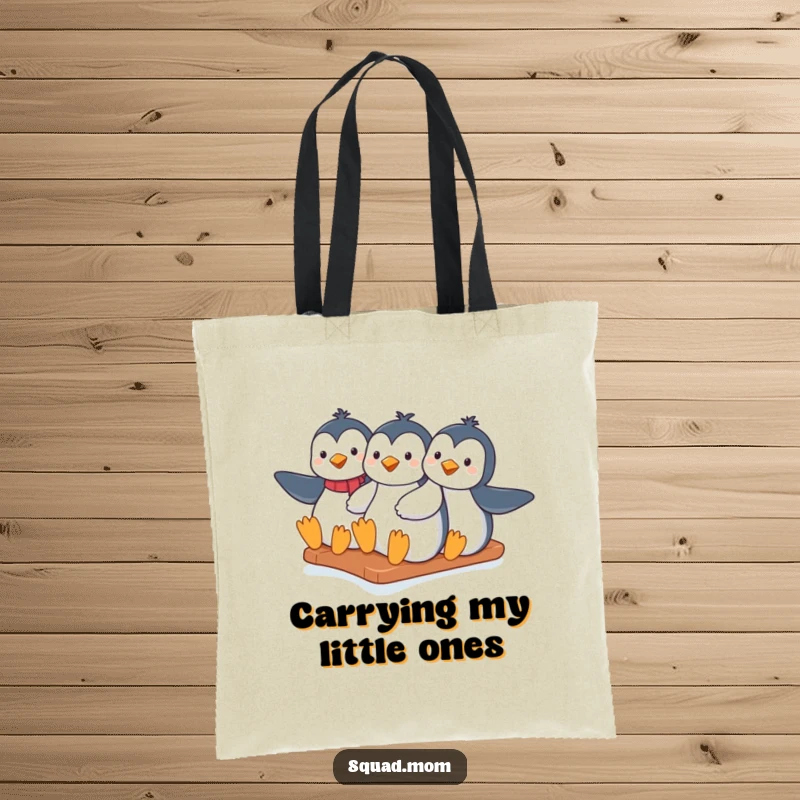 Funny penguin moms sliding down an icy hill together, printed on a durable tote bag, great for shopping and outings.